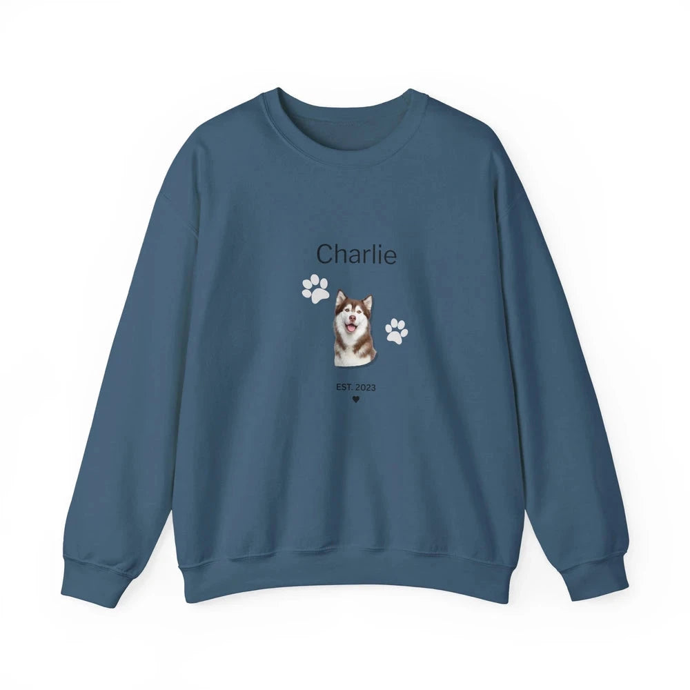 A slate blue crewneck sweatshirt featuring a custom graphic of a Shiba Inu dog with the name 'Charlie' and paw prints on the front, displayed on a clean white background.