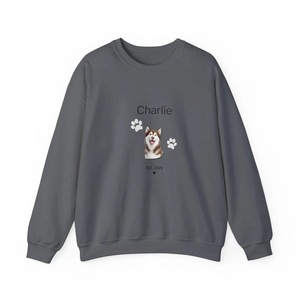 A dark gray crewneck sweatshirt featuring a custom graphic of a Shiba Inu dog with the name 'Charlie' and paw prints on the front, displayed on a clean white background.