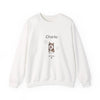 An off-white crewneck sweatshirt featuring a custom graphic print of a Husky dog named 'Charlie' with paw prints and 'EST. 2023' text on the front, displayed against a clean white background.