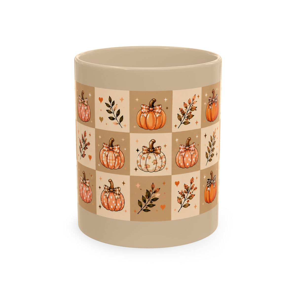 A ceramic mug with a warm beige base and a square grid pattern featuring orange and white pumpkins, leaves, and small hearts in autumn colors.